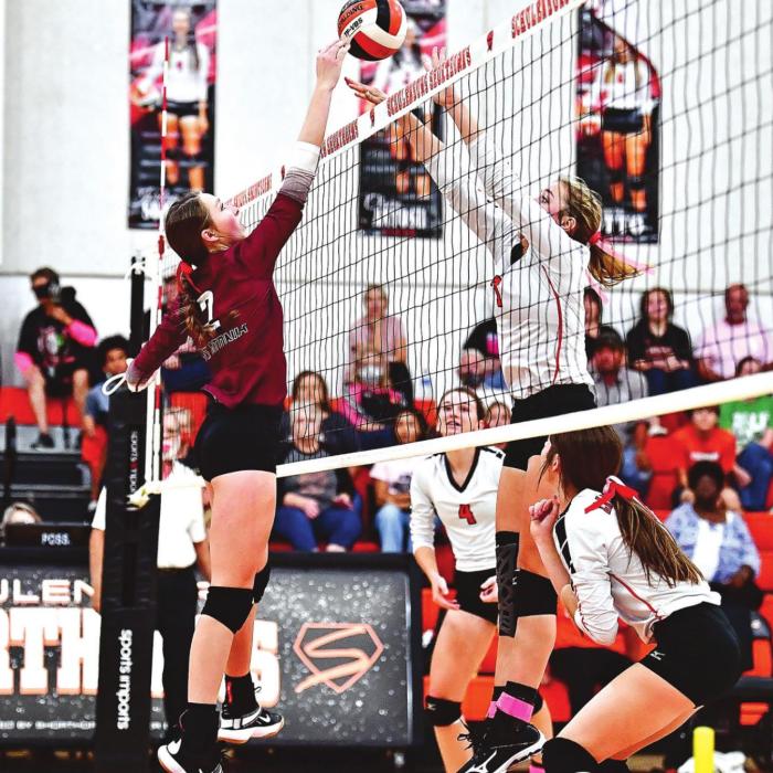 Flatonia’s Macy Bonds and Schulenburg’s Chloe Kutac battle at the net on Friday afternoon in Schulenburg. Photo by Stephanie Steinhauser