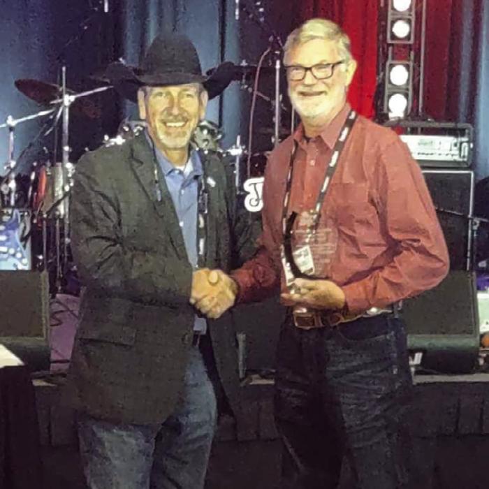 Texas Association of Fairs and Events (TAFE) presented Fayette County Fair Association President Michael Zuhn with its Volunteer of the Year Award. Zuhn is pictured above, right, receiving the award at the TAFE Convention in Fort Worth, which took place Jan. 9-11.