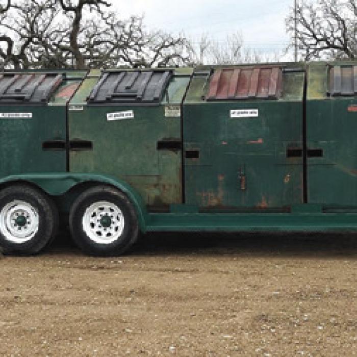 The recycle trailer in Warda is now located across from the Fellowship Hall of Holy Cross.