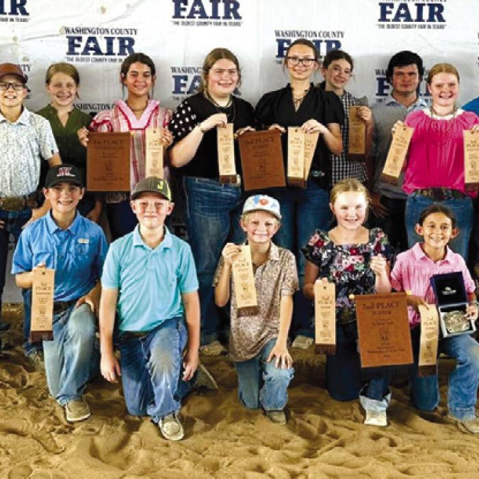 Pictured front from left kneeling: Crockett Guenther, Jehnsen Janecka, Joe Carrales, Abigale McBride, Emma Zwescpher, Rowdy Guenther, and Parker Gabler; back row: Coach JoJo Carrales, Rilan Karisch, Abraham McBride, Tate Fritsch, Hayleigh Pizzitola, Adalyn Carrales, Rheagan Karisch, Tatum Fritsch, Laramie Laake, Logan Poncik. Kaisley Janecka, Dylan Zweschper, Hudson Holub, Holden Holub, and Coach Kaci Carrales.