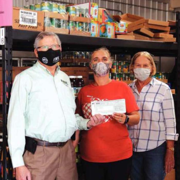 Local Co-ops Donate to AMEN & Hospice Brazos Valley
