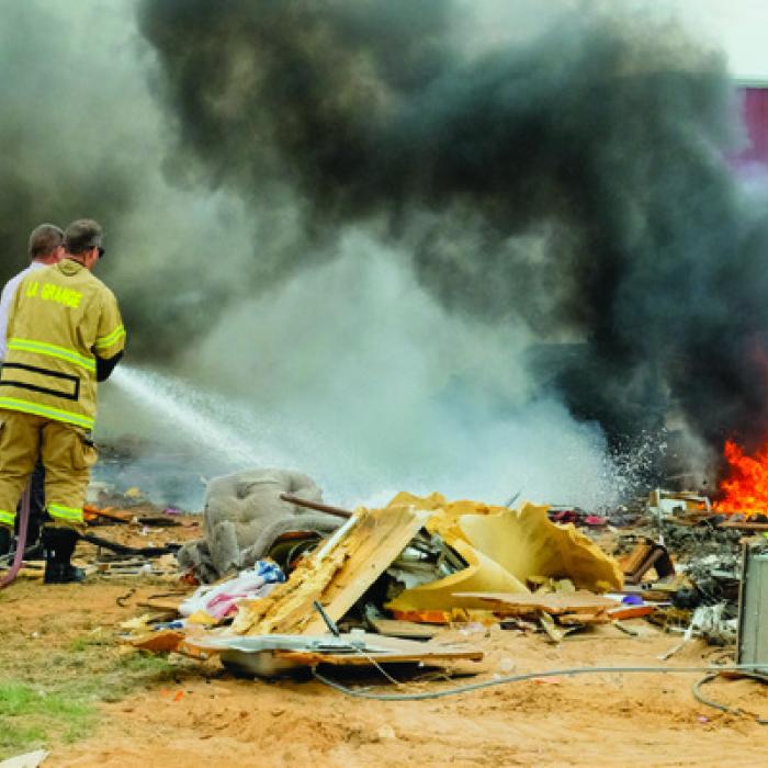 La Grange firefighters extinguished a fire that got out of control on Trinity School Rd. Thursday afternoon. Photo by Andy Behlen