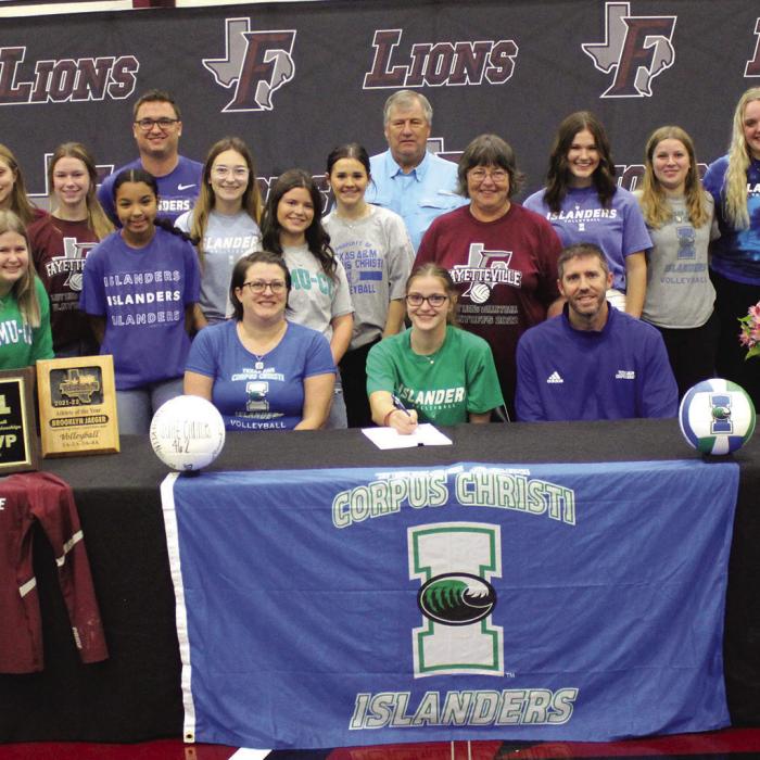 Fayetteville volleyball star Brooklyn Jaeger, who led the lady Lions to last year’s 1A state volleyball title, officially signed a scholarship agreement to play for Texas A&amp;M Corpus-Christi Wednesday. During her signing ceremony she wanted her teammates to pose with her as she signed. Seated beside Brooklyn are her parents Clint and Jennifer Jaeger. Also standing with the team are her brother Easton and grandparents Edward and Nancy Gaertner. Photo by Jeff Wick