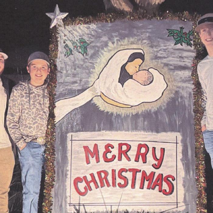 On the corner of S. Washington and W. Pecan Street in La Grange is a giant Christmas card which sends the message as a reminder of the true meaning of Christmas. It is located at the home of Jim and Norma Bowman; she was the artist who created this painting. This photo shows three wisemen who came from Beaumont to share the message. They are three of the Bowmans’ thirteen grandchildren. From left to right: Ashton, Colby, and Tyler.