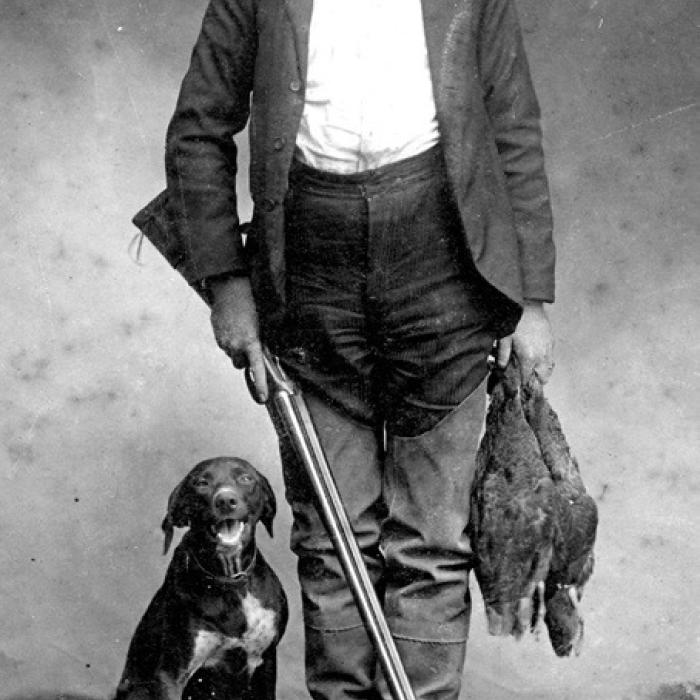 Louis Melcher in hunting gear at El Campo in 1902 with his dog, courtesy of the Fayette Heritage Museum and Archives.
