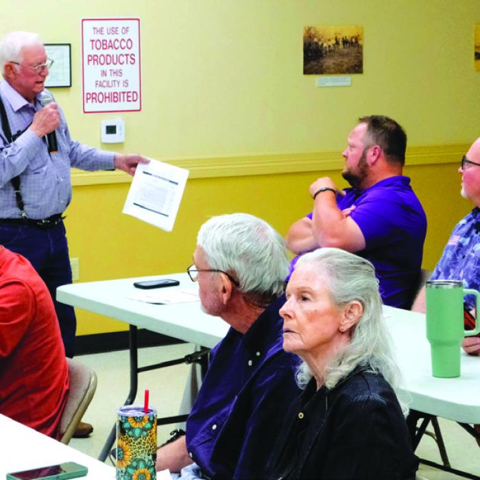 Dr. Mike Mabry questions La Grange ISD board members Anthony Wessels and Gary Drab about whether the bond will lead to improved educational outcomes at La Grange ISD. Photo by Andy Behlen