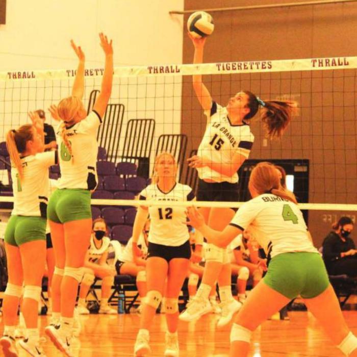 La Grange’s Ryann Marshall leaps above the net to spike this ball in Friday’s playoff game against Burnet. Photo by Jeff Wick