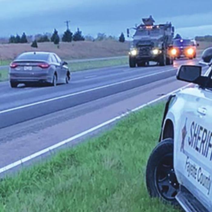 Law enforcement vehicles surrounded the car, upper left, that led officers on a pursuit over five counties.