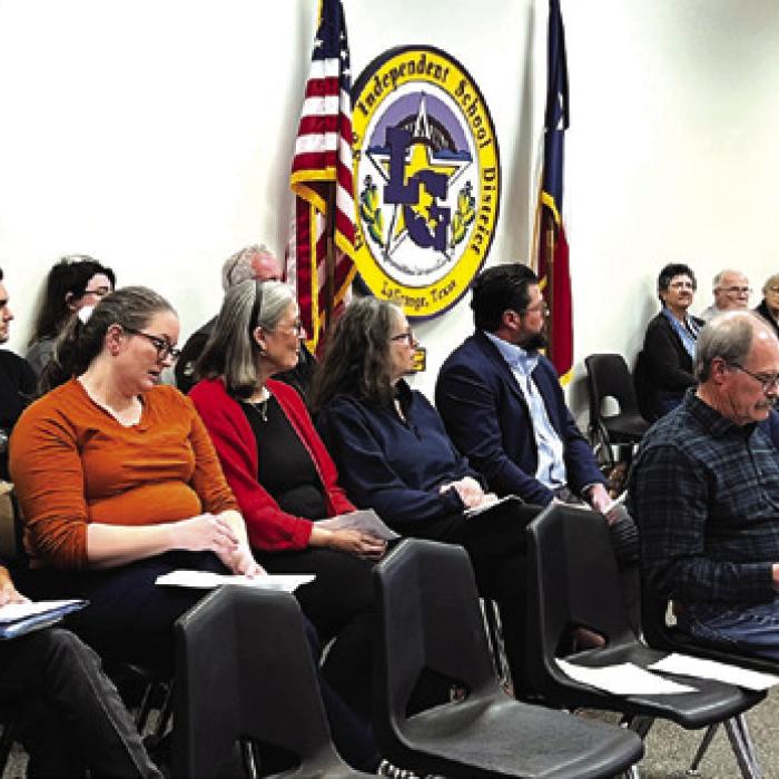 Book Scrutiny Draws a  Crowd to Board Meeting