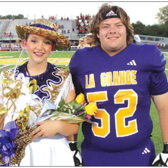 La Grange High School drill team member Savannah Bretz, left, was named Leopardette Sweetheart prior to Friday’s game as part of the homecoming festivities. She is shown here with senior football player Austin Williams, who presented her with her award. Photos by Jeff Wick