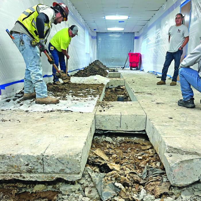 A scene Wednesday in one of the main hallways at La Grange High School as work continues to remedy serious bathroom problems. Photo by Jeff Wick
