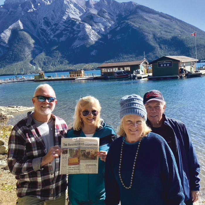 The Fayette County Record traveled to the Canadian Rockies with, from left, Fayetteville residents Patrick and Beth Mackey, along with Janet and Ed Murphy from La Grange. This photo was taken at Lake Minnewanka.