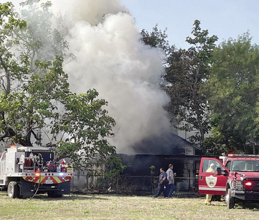 A fire in Schulenburg gutted a home on Schulz Ave. Monday afternoon. Photo by Darrell Vyvjala/The Schulenburg Sticker