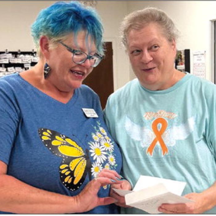 The lovely Deannie Crim with Schulenburg Family Fitness awarded Cathy Besetzny with $20 for a blackout prize. Can you see her surprise?