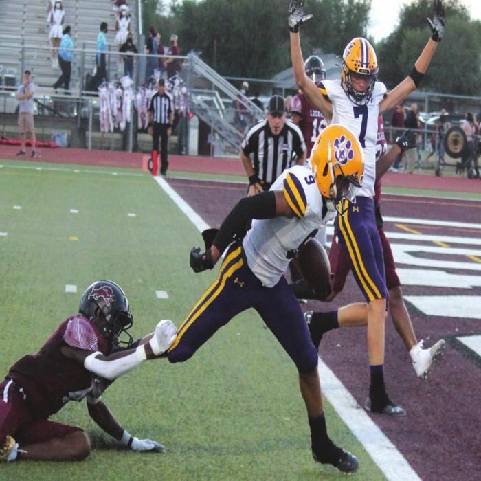La Grange’s Jakobe Wilkerson gets away from a tackler and prepares to cross the goal line for a score Friday in Lockhart as teammate Jaxon Cooper signals touchdown. Photo by Jeff Wick