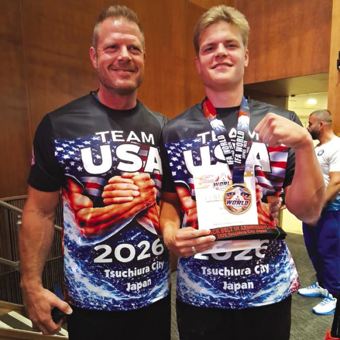 Gabriel Adamek (left) and his son AJ (right) both brought home awards from the World Armwrestling Championship in Japan last week. AJ won first place in the left-handed division of the 19-21 age bracket for his weight class. His dad won third place in left-left handed division of the grandmaster bracket.