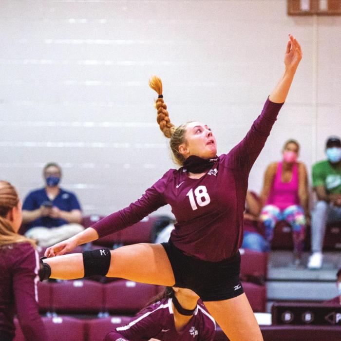 Karli Siptak makes an acrobatic move on the front row for the Flatonia Lady Bulldog volleyball team in Tuesday’s victory over Ganado. Photo by Stephanie Steinhauser