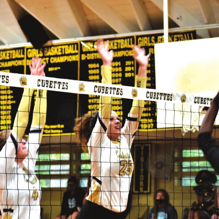 Round Top-Carmine’s Shyann Lawrence and Brooke Schobel jump at the net in Tuesday’s sweep of Richards. Photo by Paul Kipp