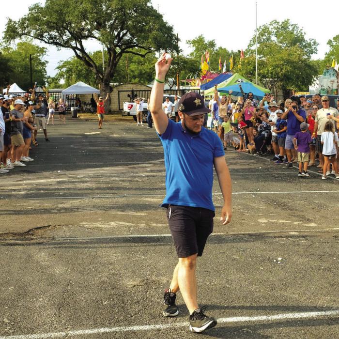 Photos by Andy Behlen Jay Heinrich holds up with winning catch in the Egg Toss Contest.