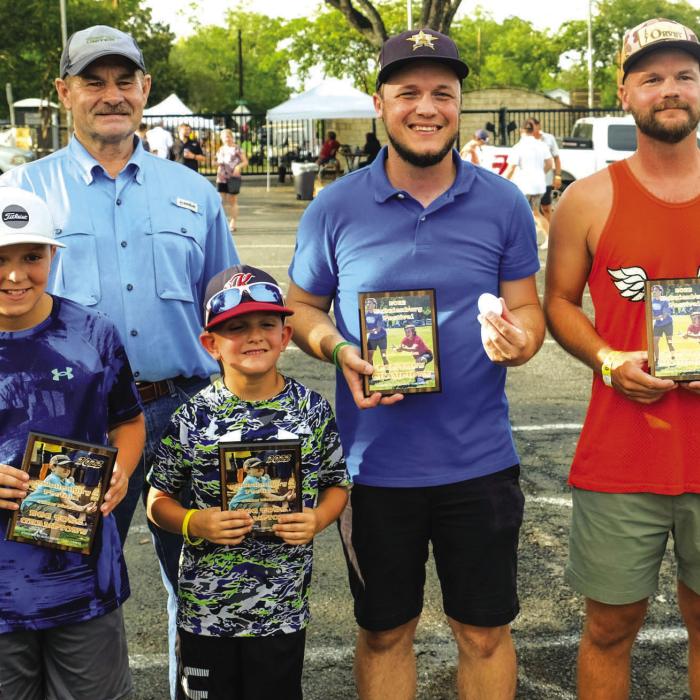Pictured are (back left) Mark Vecera of the Schulenburg Young Farmers with winners of the Young Farmers Egg Toss Contest: front, from left) Junior Division - Chase Collins and Cale Collins of Katy and (back) Adult Division - Schulenburg natives Jay Heinrich and Cale Heinrich.