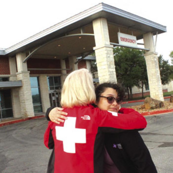 St. Mark’s Physicians’ Director Allyson Borgstedte hugs a co-worker Thursday morning outside St. Mark’s.