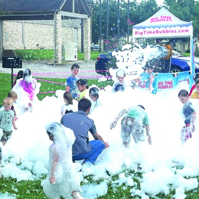 The Fayette Public Library concluded their 2024 summer reading program with a Party in the Park attended by hundreds of kids and their parents Thursday. Here’s a look at one of the party stations – a bubble machine. Photo by Jeff Wick
