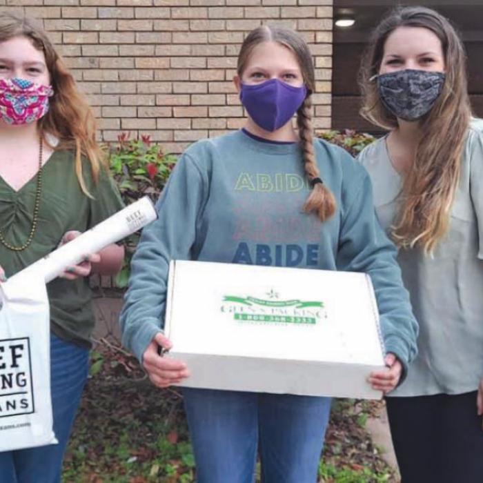 La Grange ISD received beef from Navidad CattleWomen. Pictured from left: Junior CattleWomen Rheagan Karisch and Kaylee Hensley with Kamdyn Dandignac, LGISD culinary teacher.