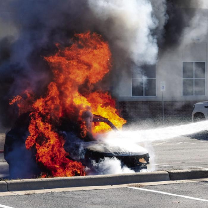 La Grange Fire Chief Frank Menefee and Asst. Chief Todd Johnson attack the flames with a stream of water. Photo by Andy Behlen