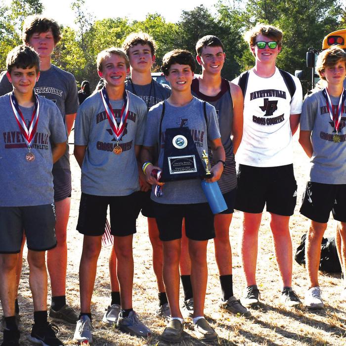 The Fayetteville boys pose with their district title trophy.