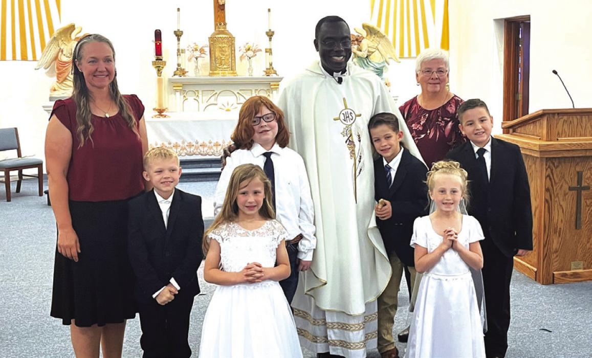 Students from the Hostyn and Plum churches celebrated First Holy Communion May 14 at St. Peter and Paul Catholic Church in Plum. Pictured are (front, from left) Parker Hatfield and Aubrey Gommert, (back) Teacher Brianne Bernsen, Jacoby Zaruba, Frank Machala, Father Felix Twumasi, Penn Wick, Teacher Monica Muras and Waylon Gulash.