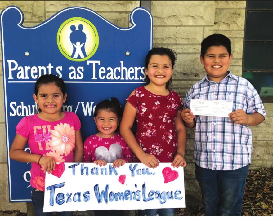Pictured from left to right are the children of Carlos and Zenaida Hernandez-Molina, Isabella, Ivanna, Iliana, and Carlos, a PAT family, graciously accepting the check to support the literacy and school readiness components of the program.