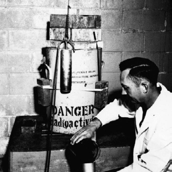 Entomology Research Branch, Insects Affecting Man and Animals Section, Agricultural Research Service, United States Department of Agriculture. “Photograph Loading an Irradiation Chamber with Screw-Worm Pupae.” Special Collections, USDA National Agricultural Library. Accessed June 13, 2026, https://www.nal.usda. gov/exhibits/speccoll/ items/show/7333.