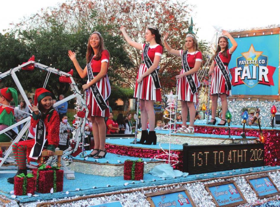 The Fayette County Fair Queen’s Royalty Court float, part of the parade that began the night’s festivities.