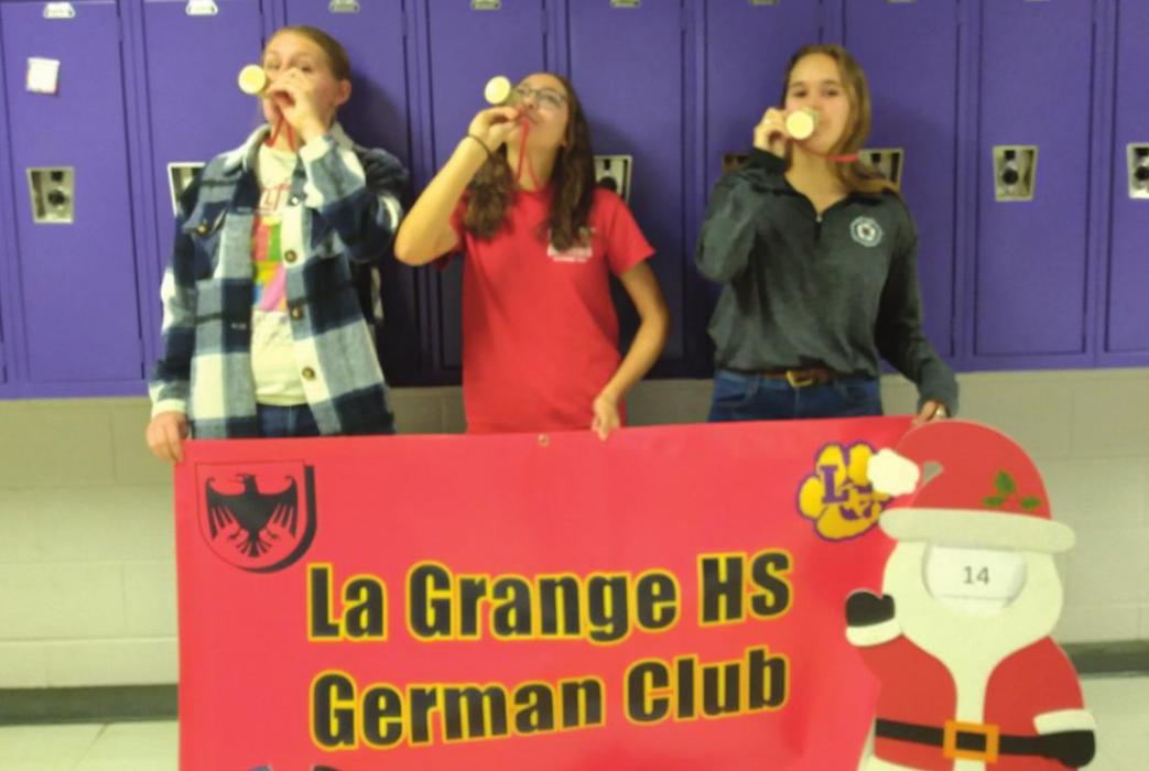 Best Unleaded Wassail was won, for the second consecutive year by La Grange High School German Club. Left to right are Jill Newton, Rory Halpain (Wassailmeister for German Club), and Hannah Wilson.