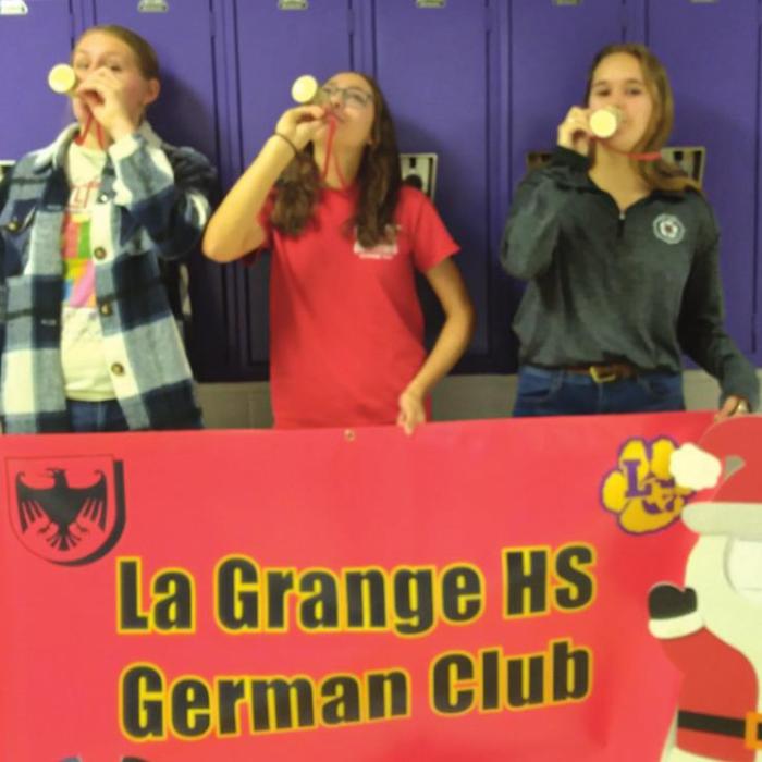 Best Unleaded Wassail was won, for the second consecutive year by La Grange High School German Club. Left to right are Jill Newton, Rory Halpain (Wassailmeister for German Club), and Hannah Wilson.