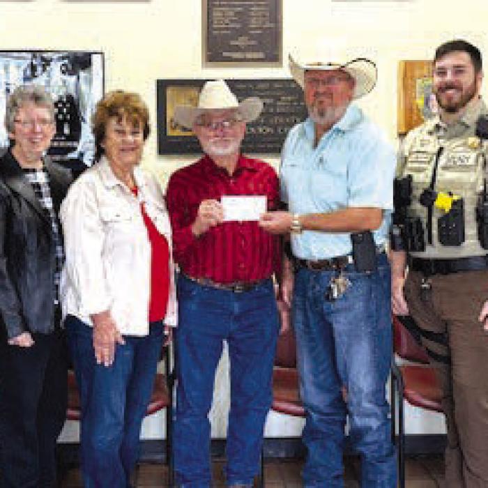 Pictured from left: KJT Treasurer Brenda Fietsam, Sgt. Ron Nauman, KJT Secretary Joyce Muras, KJT Reporter Dianna Kallus, KJT Vice-President Benedict Kallus, Lt. David Beyer, Sgt. Ryan Meagher, CIT Investigator Jeremy Castleberry, and Sgt. Detective Angela Jasek-Lala.