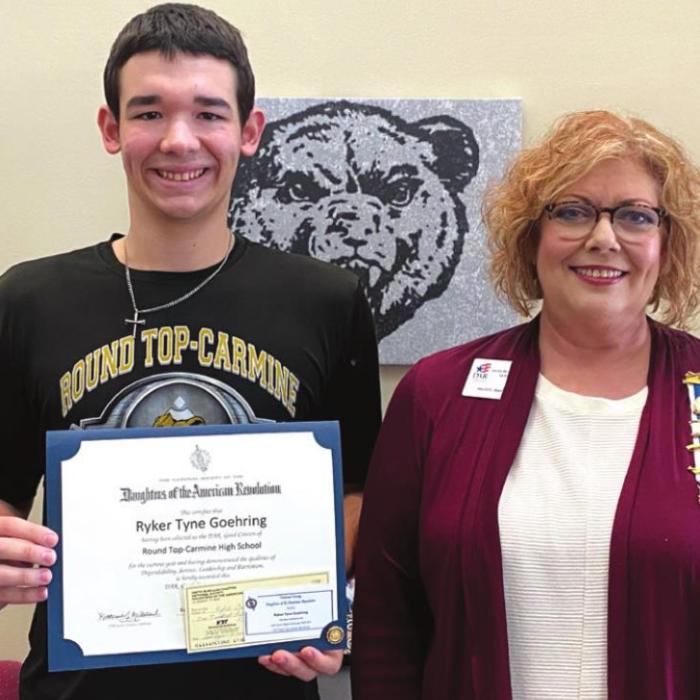 Ryker Tyne Goehring of RT-Carmine High School and Sherry Hebert, Good Citizen chairperson.