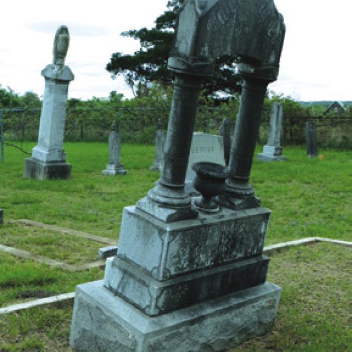 The gravestone of Joseph J. and Ida Fietsam, another example of the bad condition of the grave stones at Williams Creek Cemetery.