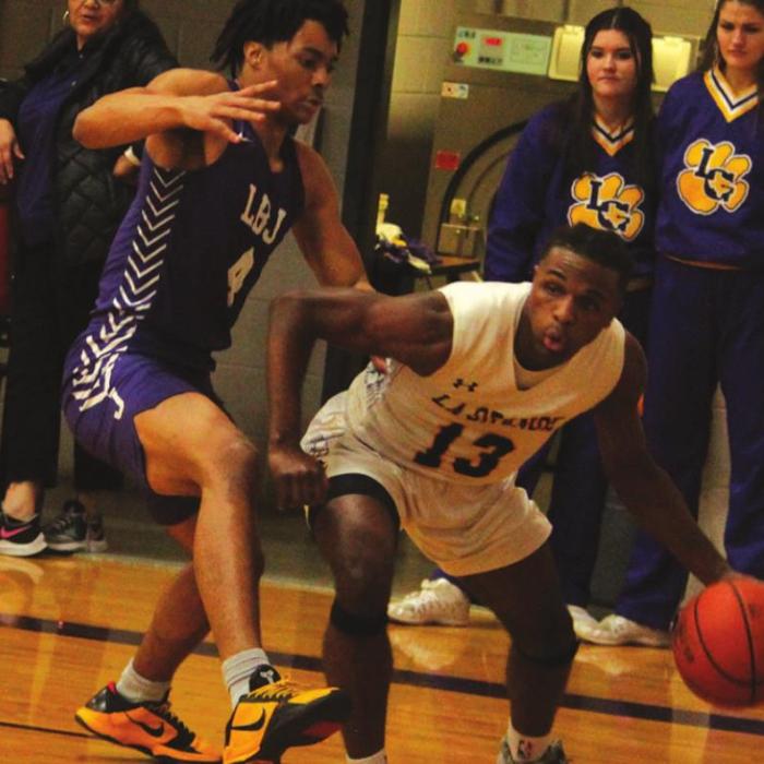 La Grange’s Dana Baker tries to dribble past an Austin LBJ player Tuesday.