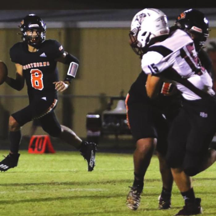 Schulenburg quarterback Tyler Ryba looks downfield for an open receiver in Friday’s game against East Bernard. Photo by Audrey Kristynik