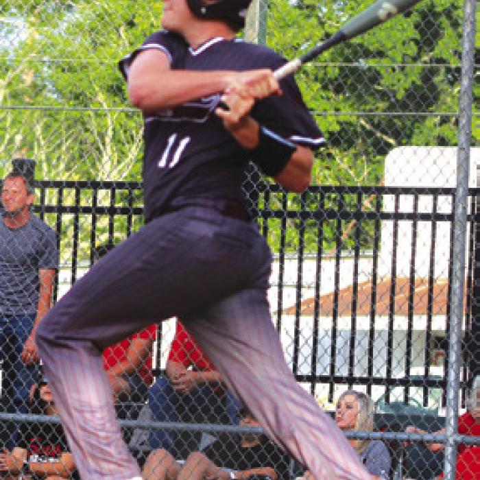 Fayetteville senior Parker Vitek smacks a homer in his final game at his home ballpark Monday. Photos by Lacey Vitek