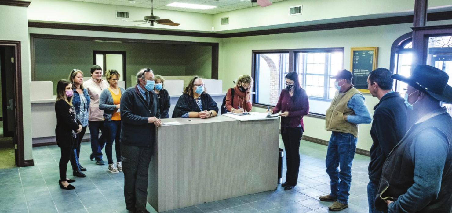 Fayette County Judge Joe Weber and the four commissioners along with staffers from several County offices toured the Old Pioneer Bank Building on Monday, which the County hopes to turn into a courthouse annex. Photo by Andy Behlen