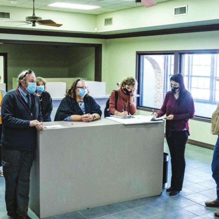 Fayette County Judge Joe Weber and the four commissioners along with staffers from several County offices toured the Old Pioneer Bank Building on Monday, which the County hopes to turn into a courthouse annex. Photo by Andy Behlen