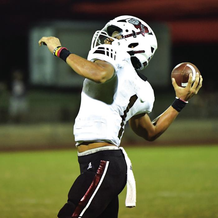 Senior Quarterback Fidel Venegas throws to Keyshaun Green in the second half of Friday night’s season opener in Shiner against the St. Paul Cardinals. Photos by Stephanie Steinhauser