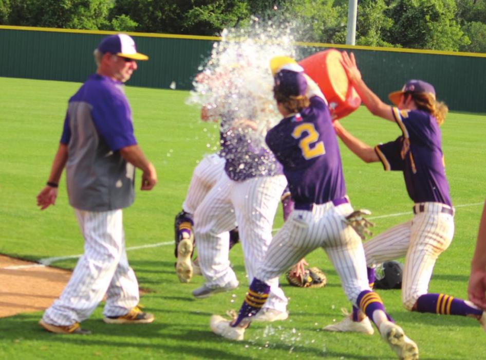 La Grange players dump a cooler of ice water on manager Robert Barber after Saturday’s decisive Game 3 victory. Photos by Jeff Wick