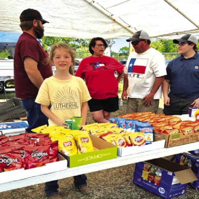 Landry Bertsch, Remi Denham, Tara Sickon, Bill Sickon, and Jonathan Table are ready to serve and waiting for lunch to start.