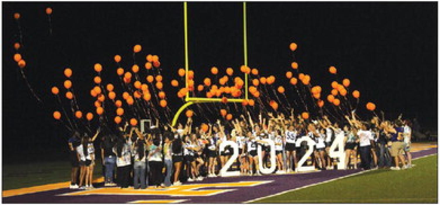 Members of the La Grange High School senior class of 2024 release balloons at the conclusion of Wednesday’s community homecoming pep rally. The class chose orange balloons in part to honor Cesar Villasana, a member of this class who died in 2022 of leukemia. Photos by Jeff Wick