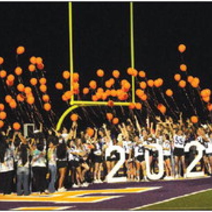 Members of the La Grange High School senior class of 2024 release balloons at the conclusion of Wednesday’s community homecoming pep rally. The class chose orange balloons in part to honor Cesar Villasana, a member of this class who died in 2022 of leukemia. Photos by Jeff Wick