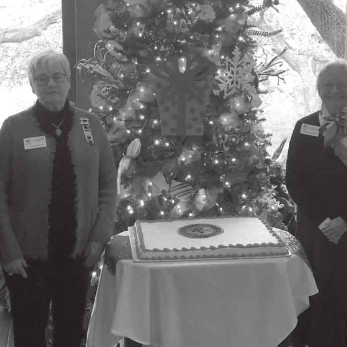 Pictured left to right: John D. Marburger, guest speaker Sue Lane McCulley, Regent Sally Reynolds, member and guest speaker Bruce Buckhorn. Both gentlemen accepted Service to America lapel pins