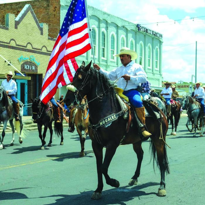 An equestrian group led by Orlando Adame brought up the rear of the Schulenburg Festival Parade.